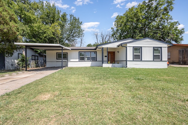 ranch-style house featuring a front yard and a carport