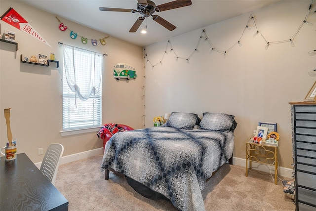 bedroom with ceiling fan and light colored carpet