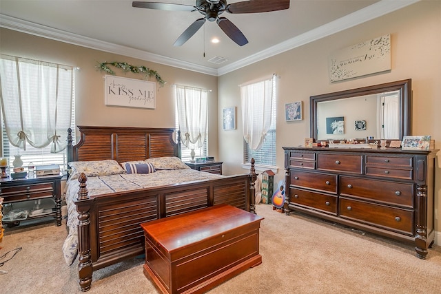 bedroom with ceiling fan, crown molding, and light carpet