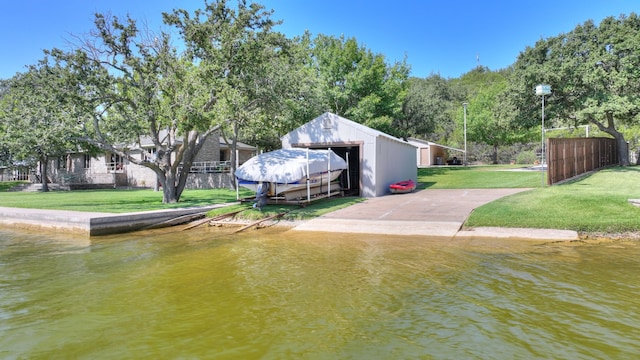 dock area featuring a water view and a yard