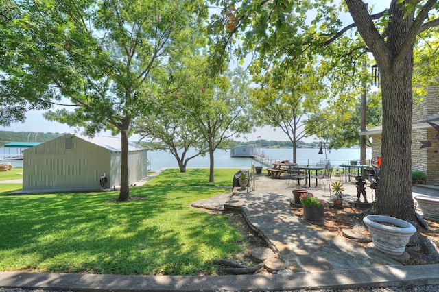 view of yard featuring a patio area and a water view