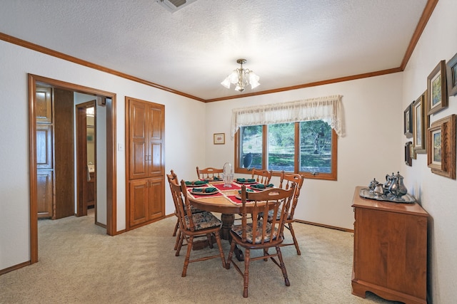 dining room with an inviting chandelier, crown molding, light colored carpet, and a textured ceiling