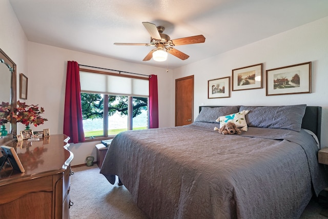 bedroom with light carpet and ceiling fan