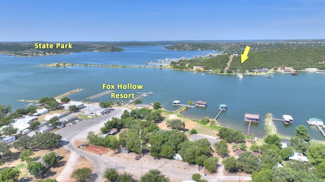 birds eye view of property with a water view