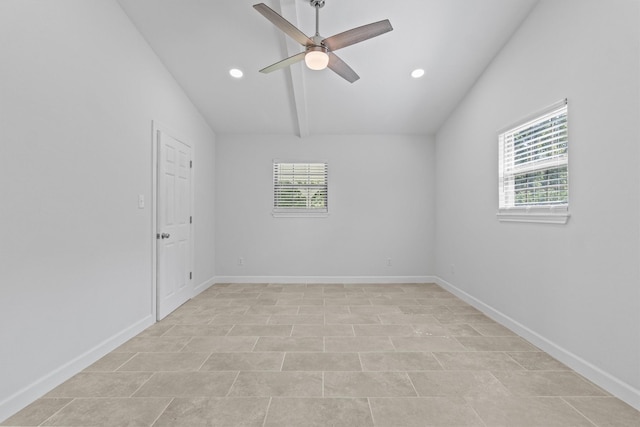 spare room featuring ceiling fan, a wealth of natural light, and baseboards