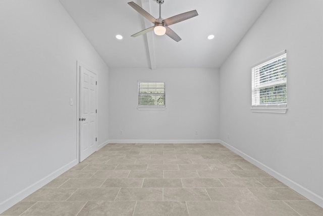 unfurnished room with ceiling fan, lofted ceiling, and light tile patterned floors