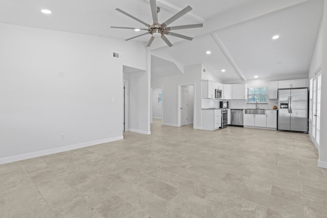 unfurnished living room with high vaulted ceiling, light tile patterned flooring, beam ceiling, ceiling fan, and sink