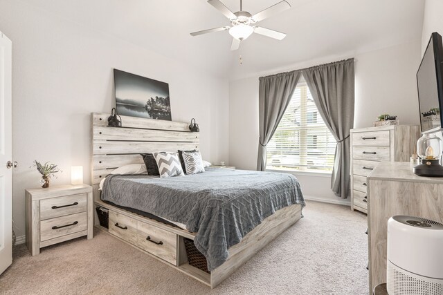 bedroom with ceiling fan and light carpet