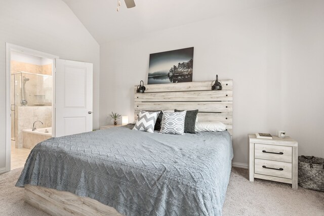 carpeted bedroom with lofted ceiling, ceiling fan, and ensuite bathroom