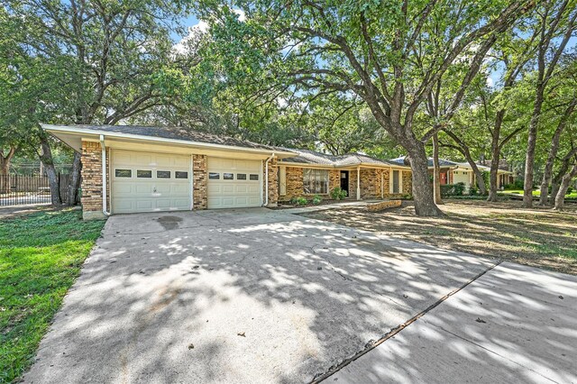 ranch-style home featuring a garage