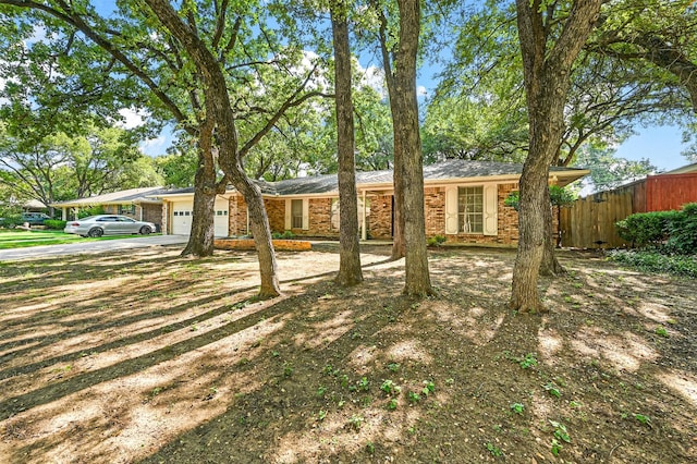 ranch-style home featuring a garage