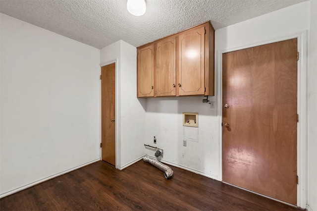 laundry area featuring electric dryer hookup, hookup for a washing machine, dark hardwood / wood-style flooring, and a textured ceiling