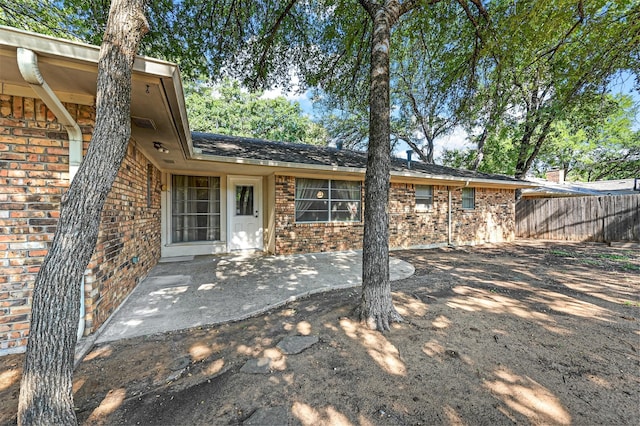 back of property with a patio area