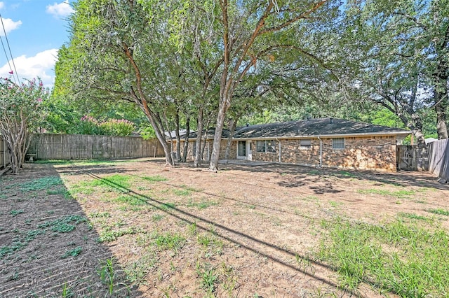 view of yard with a fenced backyard