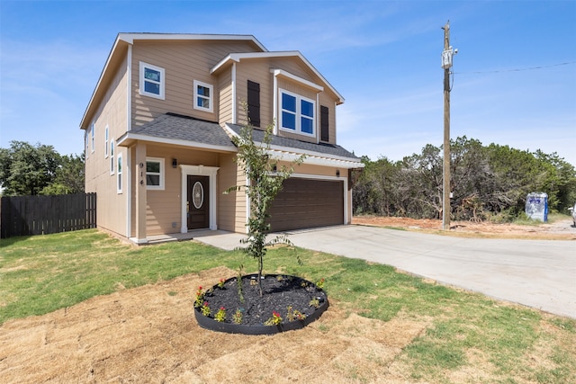 view of front of house with a front lawn and a garage