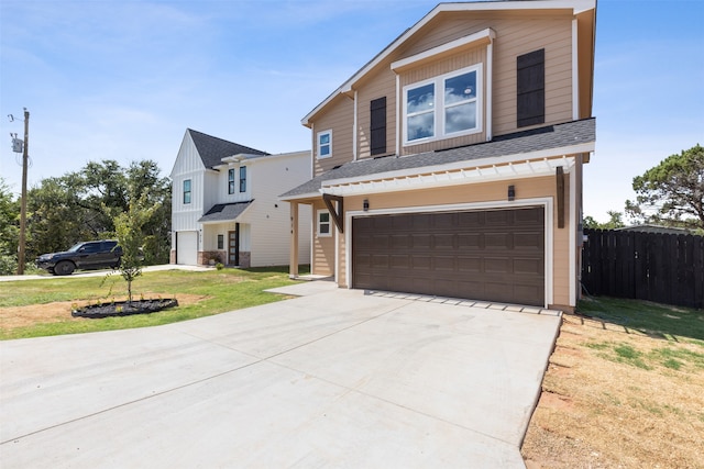 view of front of property with a front lawn and a garage