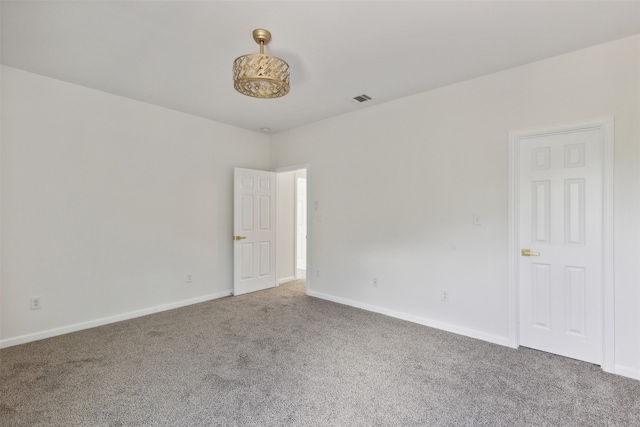 empty room featuring carpet floors