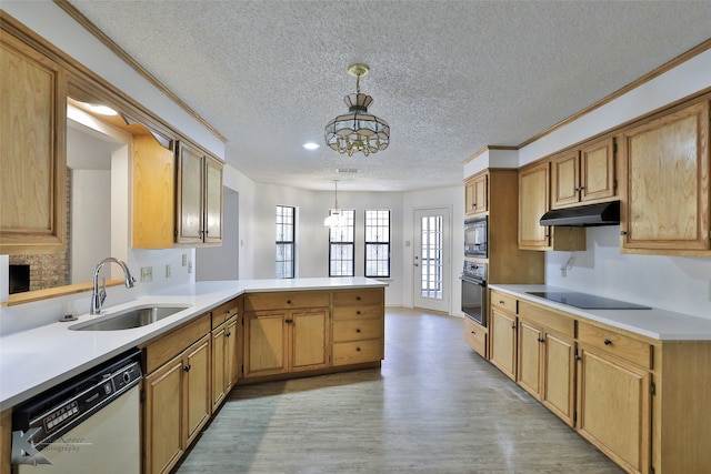 kitchen with black appliances, light wood-type flooring, sink, and kitchen peninsula