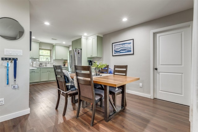 dining space with sink and dark hardwood / wood-style floors