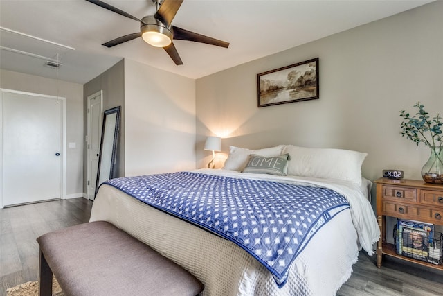 bedroom with ceiling fan and hardwood / wood-style flooring