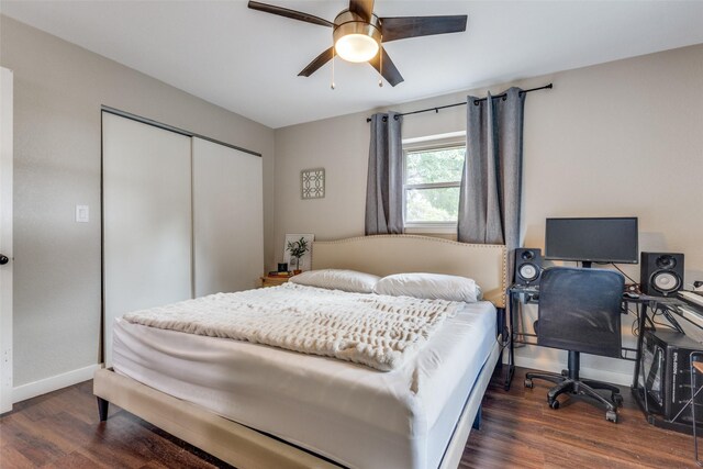 bedroom with a closet, ceiling fan, and dark hardwood / wood-style flooring