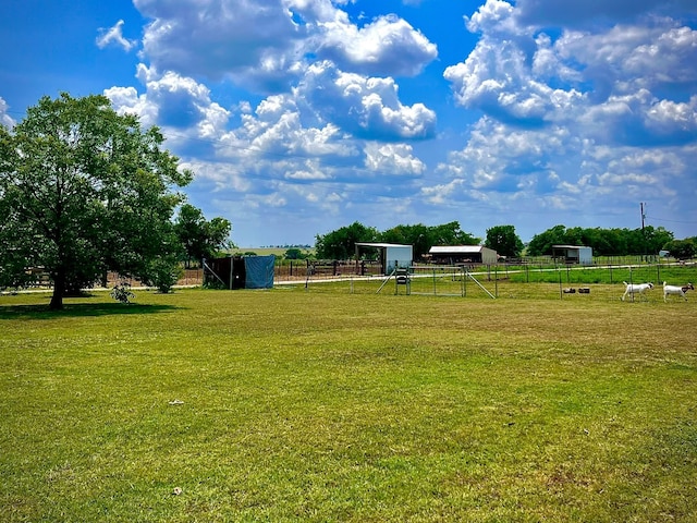 view of yard featuring a playground and a rural view