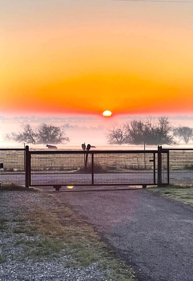 view of gate at dusk