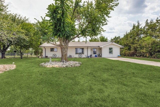 ranch-style home with a front lawn