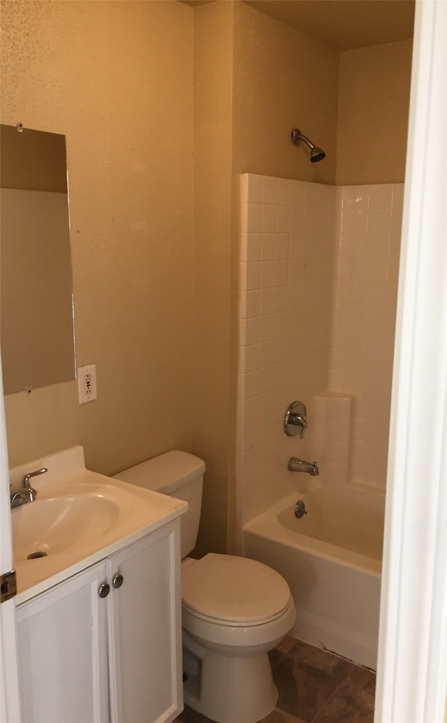 full bathroom featuring toilet, vanity, and shower / bathing tub combination