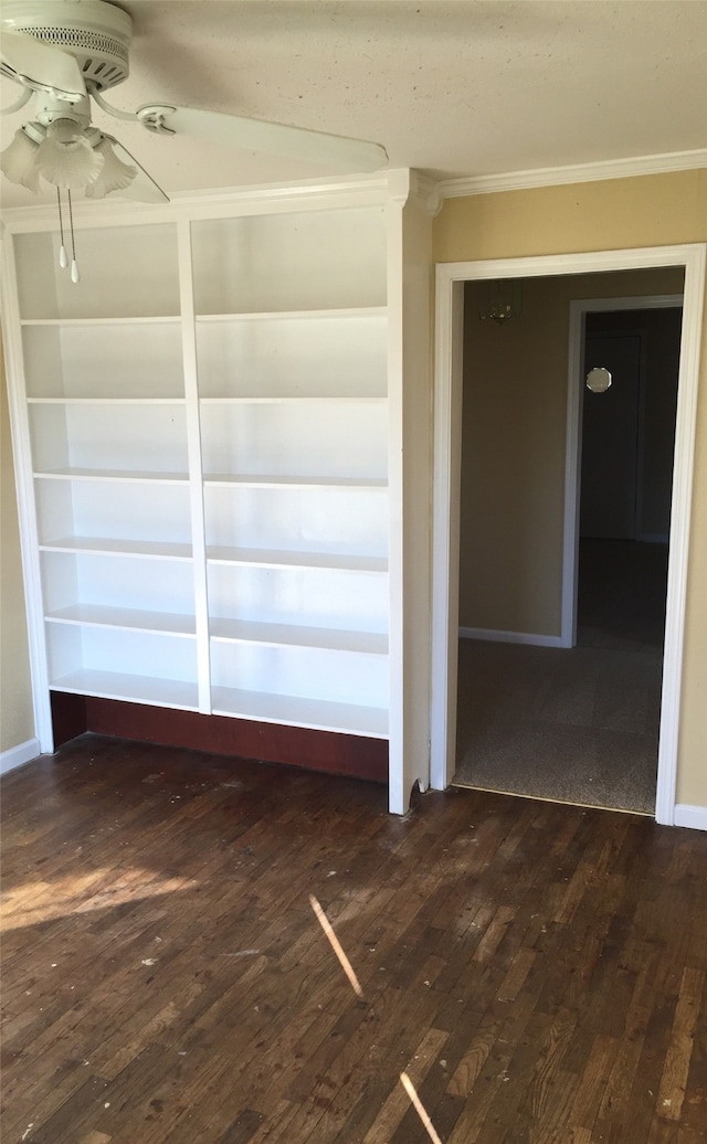 spare room featuring ornamental molding, dark hardwood / wood-style floors, and ceiling fan