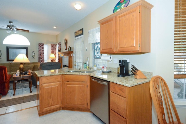 kitchen featuring kitchen peninsula, plenty of natural light, stainless steel dishwasher, and sink