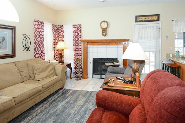 living room featuring light tile patterned floors and a fireplace