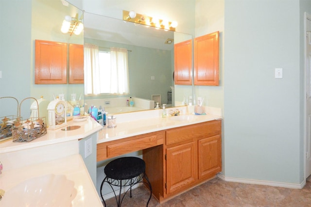 4821 Worthing Dr, Garland, TX 75043 - bathroom with vanity, baseboards, and a bath