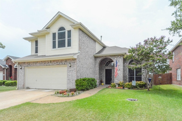 view of front of home with a front yard and a garage