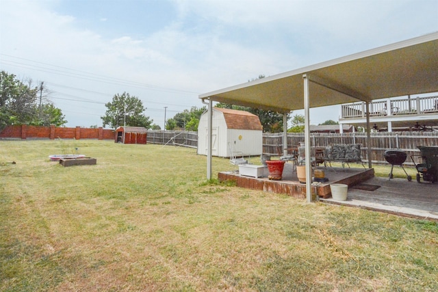 view of yard with a patio and a shed