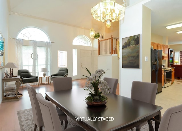 4821 Worthing Dr, Garland, TX 75043 - dining room featuring a chandelier, light wood-style floors, and crown molding