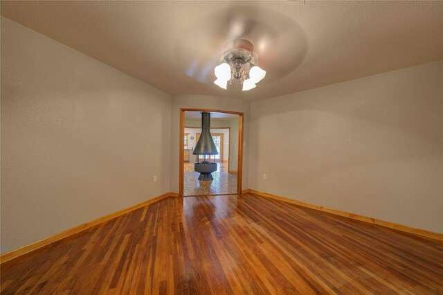 spare room featuring hardwood / wood-style flooring and ceiling fan