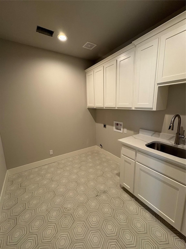 laundry area featuring washer hookup, sink, cabinets, and hookup for an electric dryer