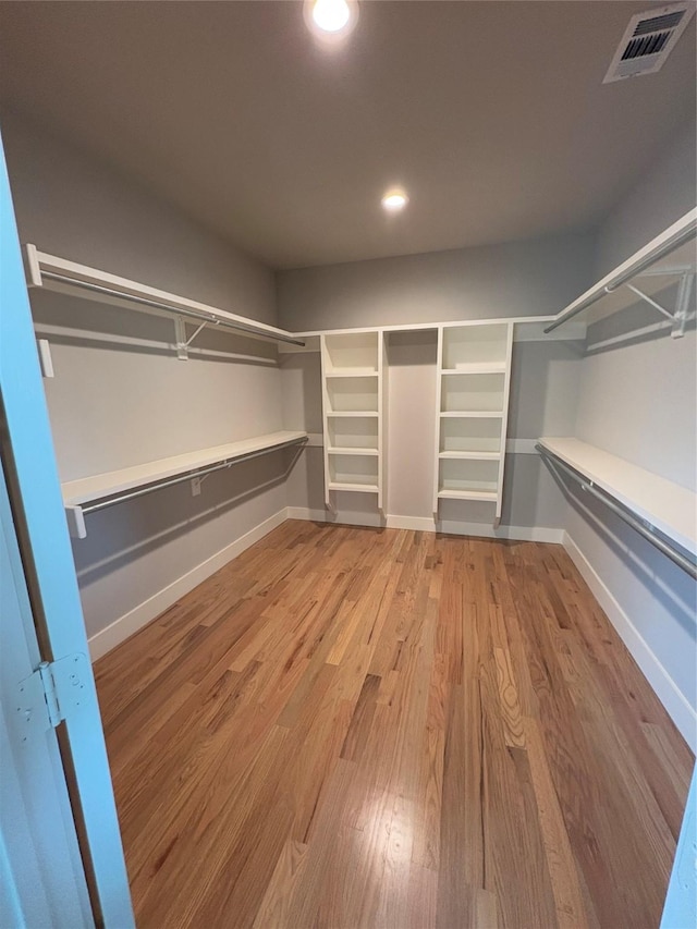 spacious closet featuring wood-type flooring