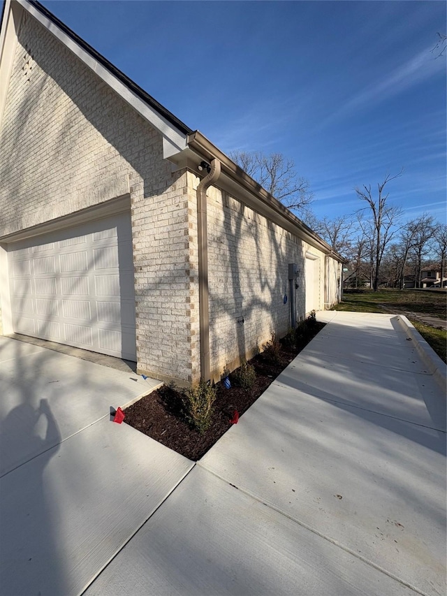 108 Southern Pine Pl, Mabank, TX 75156 - view of side of home with driveway, an attached garage, and brick siding