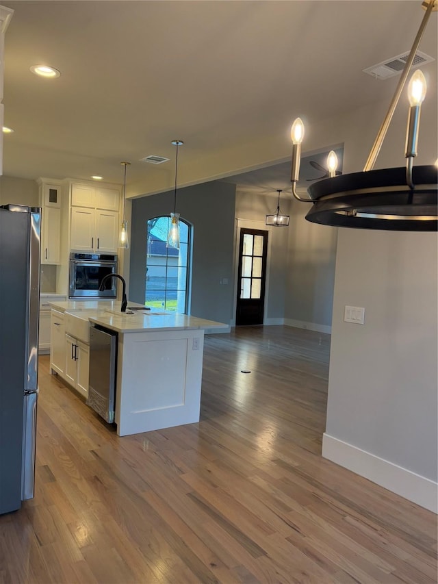 108 Southern Pine Pl, Mabank, TX 75156 - kitchen with stainless steel appliances, white cabinetry, baseboards, light countertops, and recessed lighting