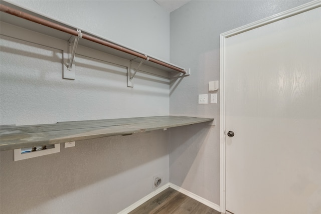 laundry room featuring hardwood / wood-style flooring and electric dryer hookup