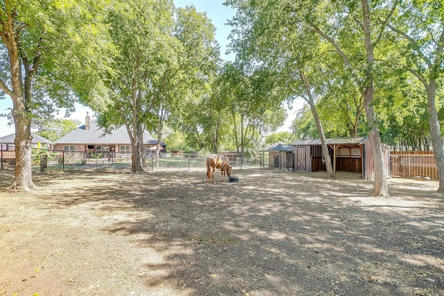 view of yard with an outdoor structure