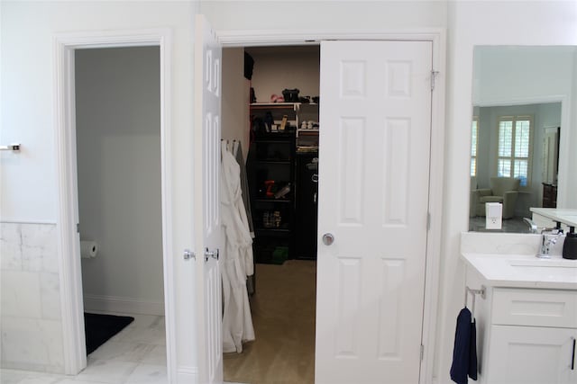 bathroom with tile patterned floors and vanity