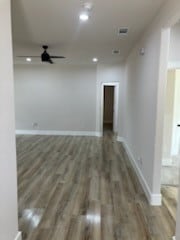 corridor with dark hardwood / wood-style floors