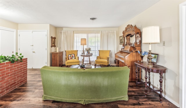 living room featuring dark wood-type flooring