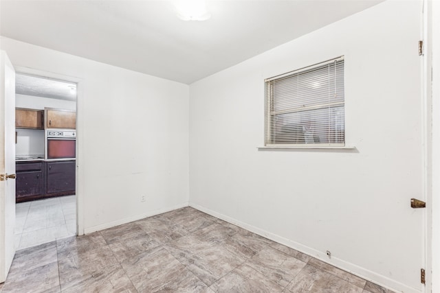 view of tiled spare room