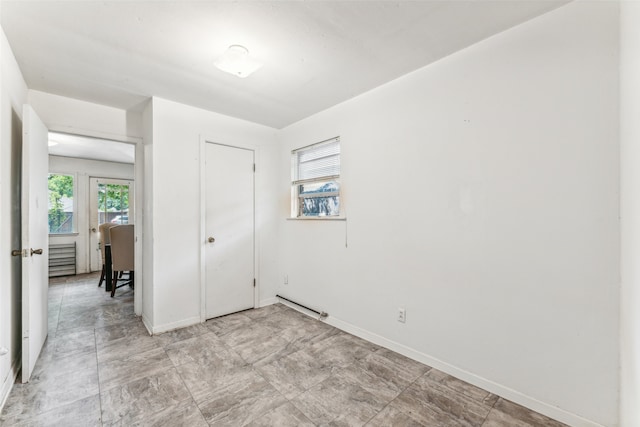 unfurnished room featuring light tile patterned floors