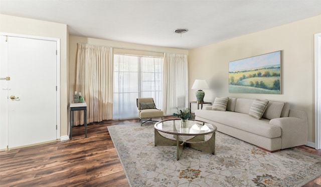 living room with dark hardwood / wood-style flooring