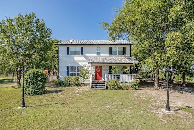 view of front of property with a porch and a front lawn